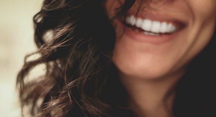 How much is an unattractive smile costing you?
